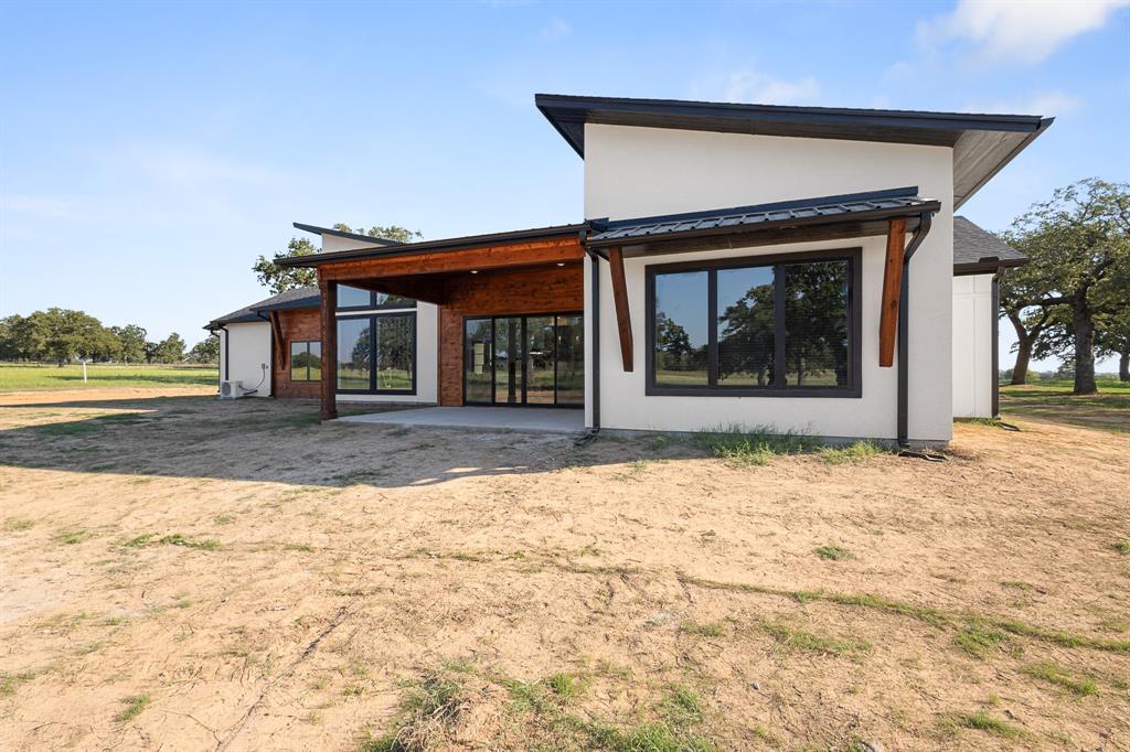 1572 Faulkner Road Sunset, TX 76270 - Photo 3 of 40 a front view of a house with a yard
