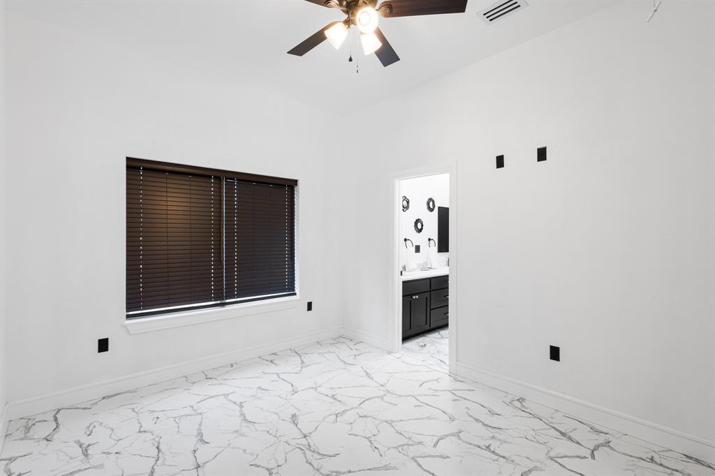 1572 Faulkner Road Sunset, TX 76270 - Photo 36 of 40 a view of an empty room with a fireplace