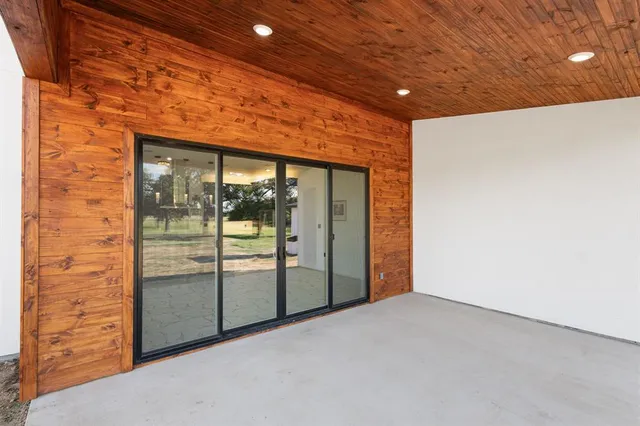 a house with swimming pool in front of it