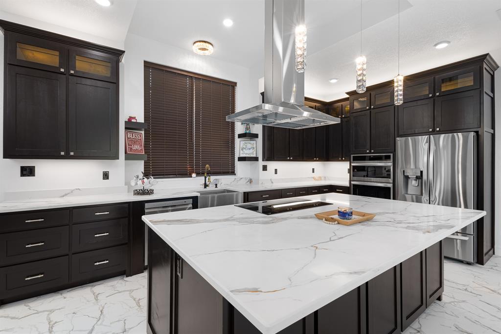 1572 Faulkner Road Sunset, TX 76270 - Photo 5 of 40 a kitchen with a sink a stove and refrigerator