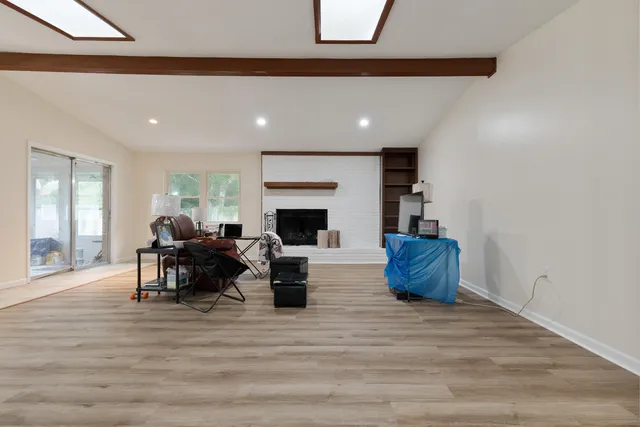 a view of kitchen with granite countertop cabinets a dining table and chairs