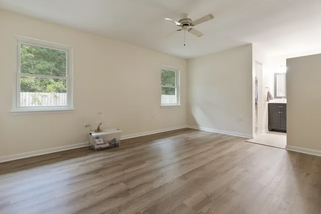 a view of walk in closet with clothes