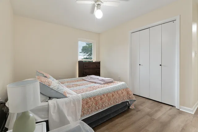 a bedroom with a bed and a dresser