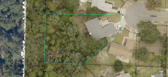 an aerial view of a houses with a lake view