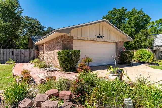 a view of a hallway with wooden floor and closet