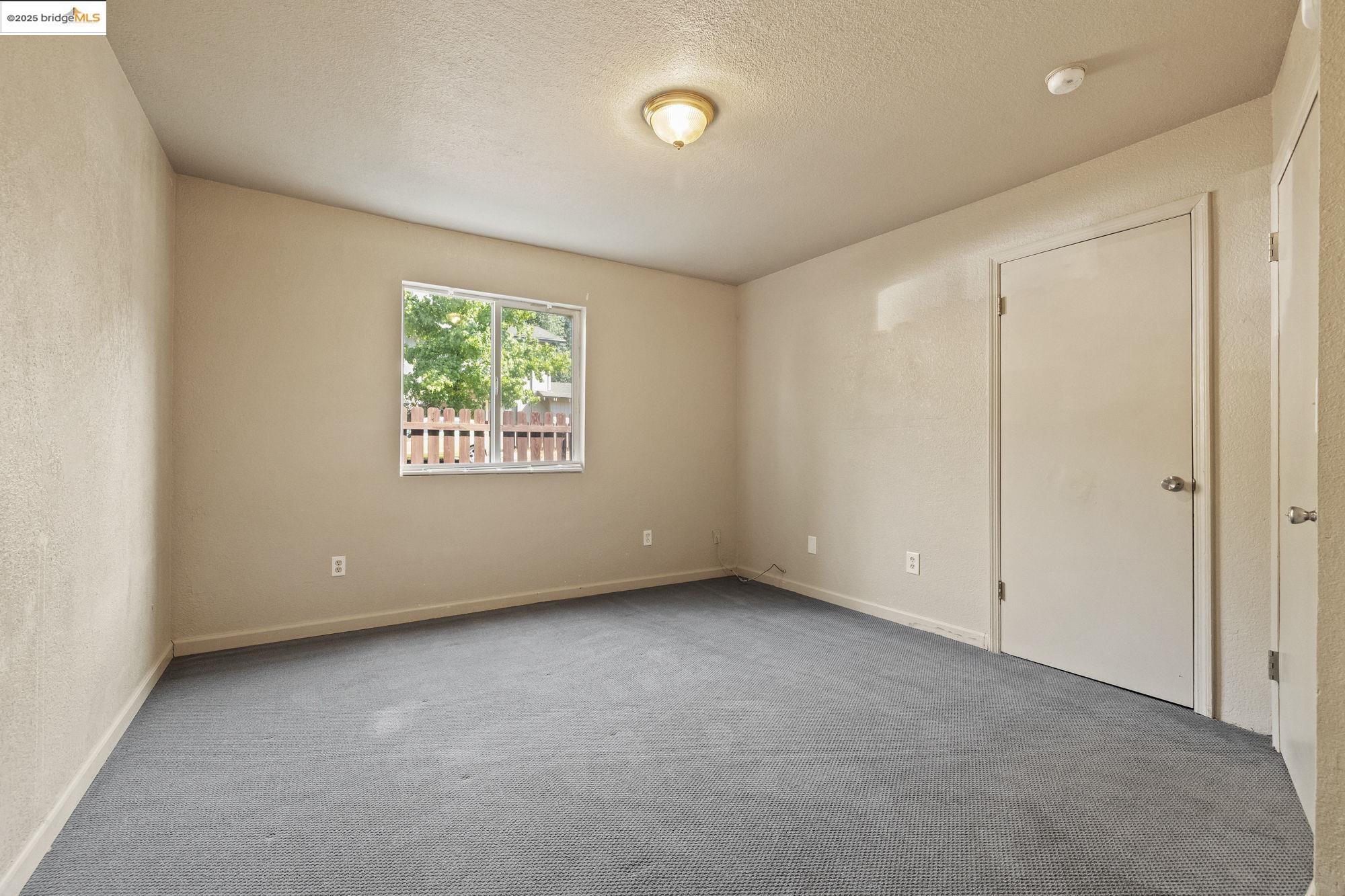 10702 10th Avenue Jamestown, CA 95327 - Photo 14 of 25 an empty room with windows