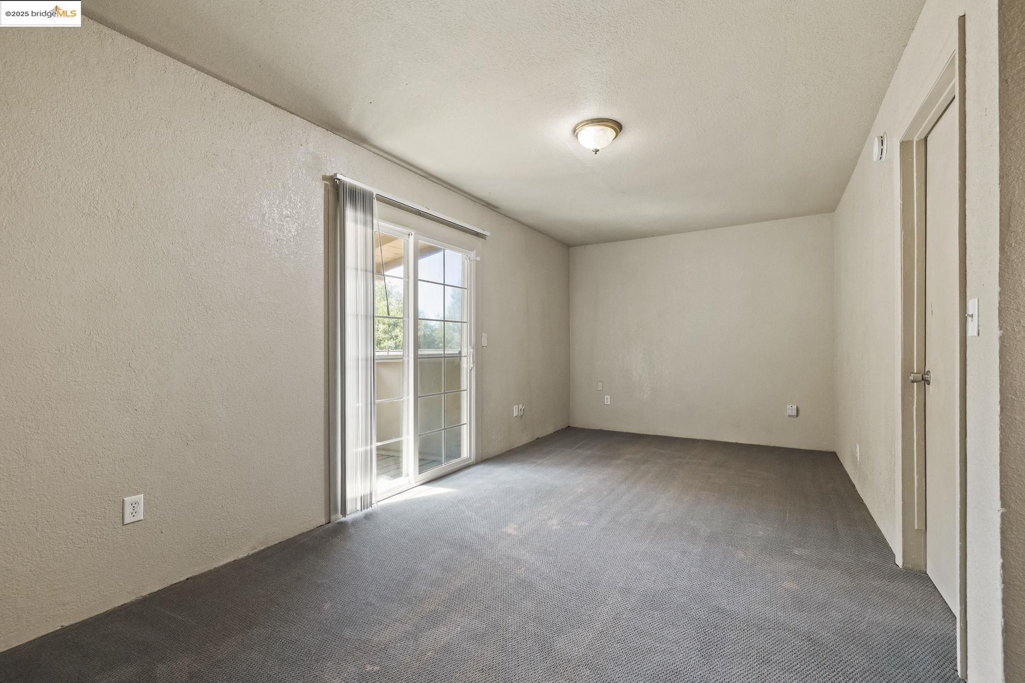 10702 10th Avenue Jamestown, CA 95327 - Photo 15 of 25 a view of an empty room with a window