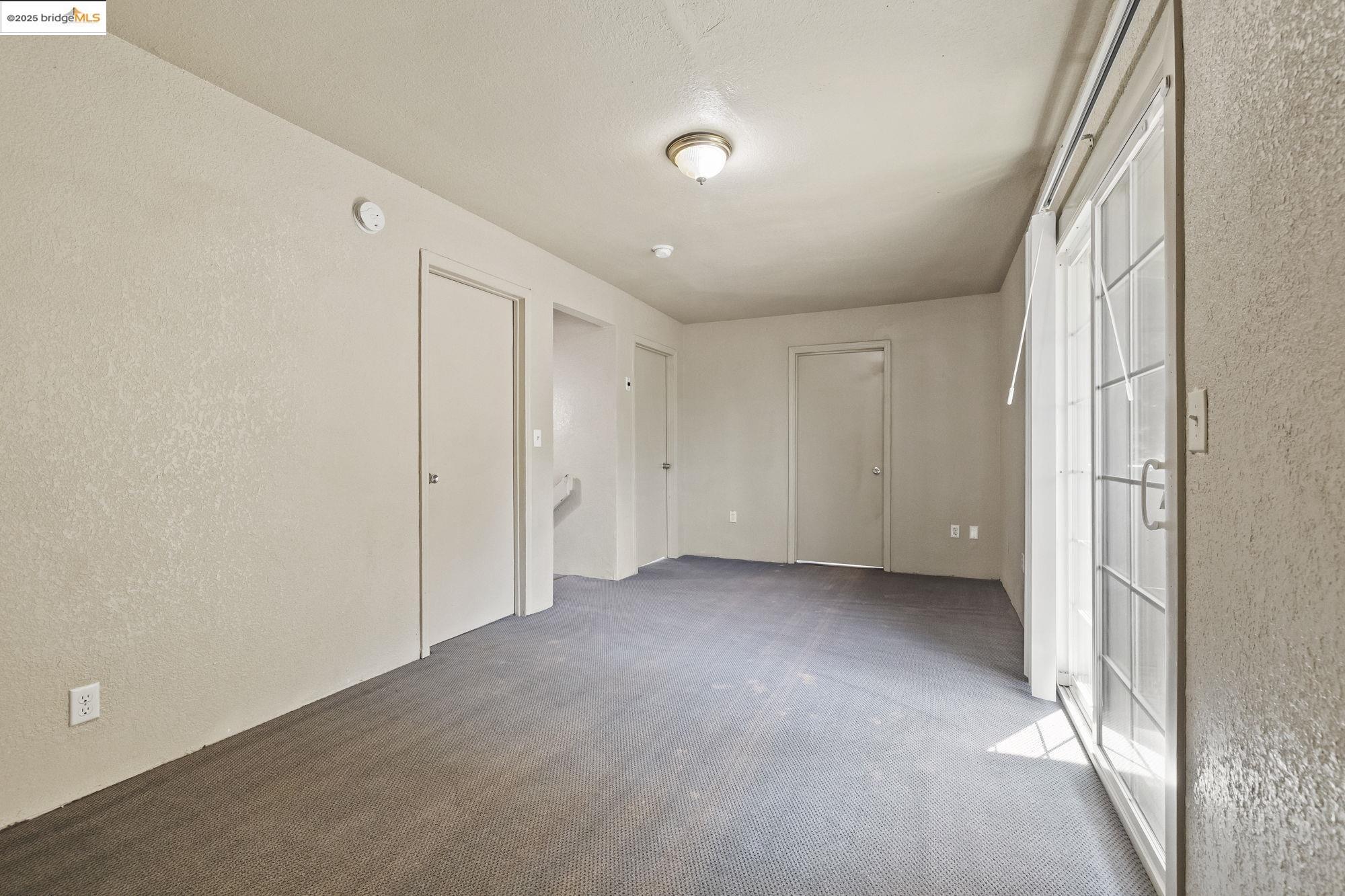 10702 10th Avenue Jamestown, CA 95327 - Photo 17 of 25 a view of a big room with closet and windows