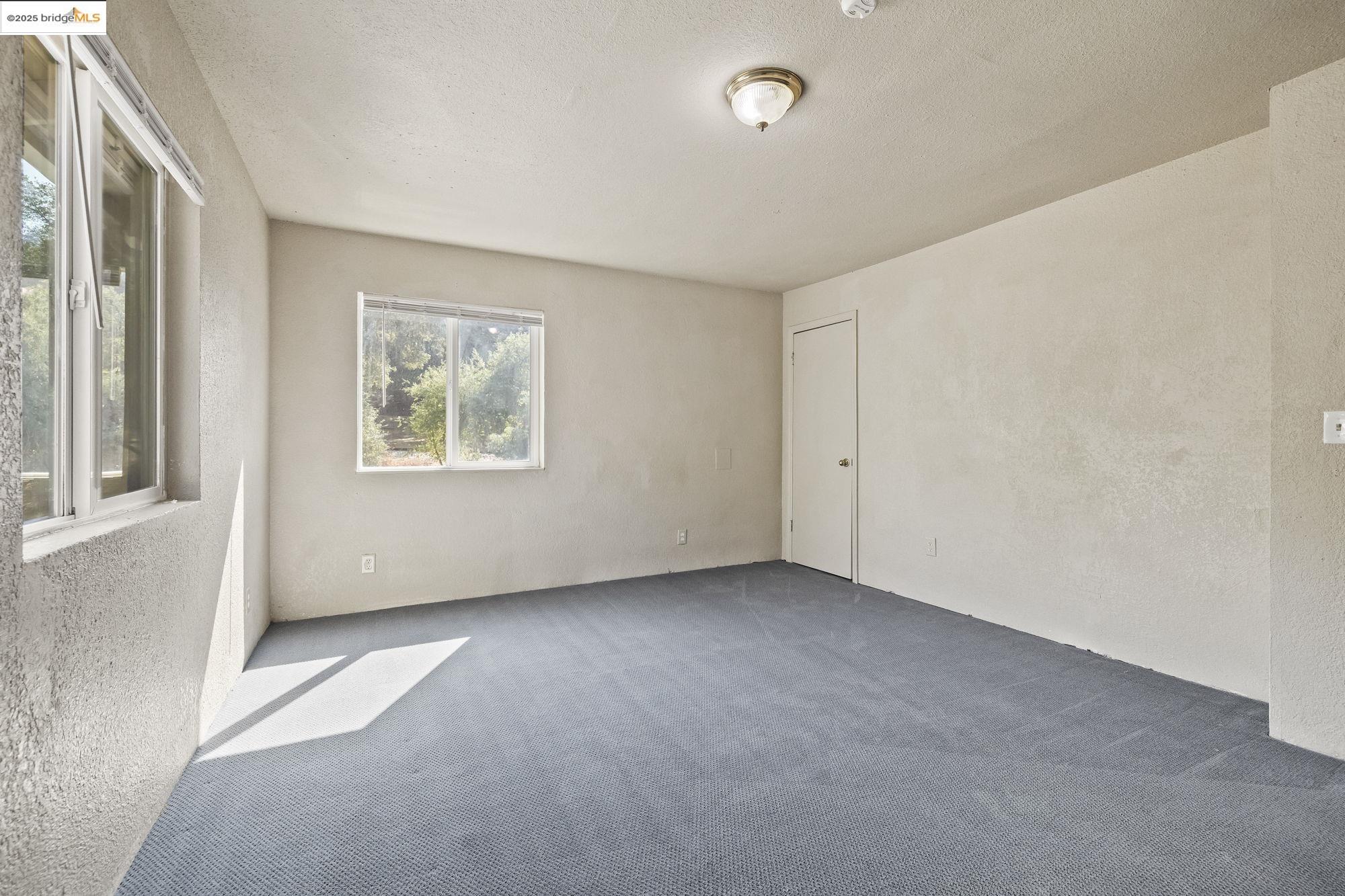 10702 10th Avenue Jamestown, CA 95327 - Photo 21 of 25 an empty room with windows