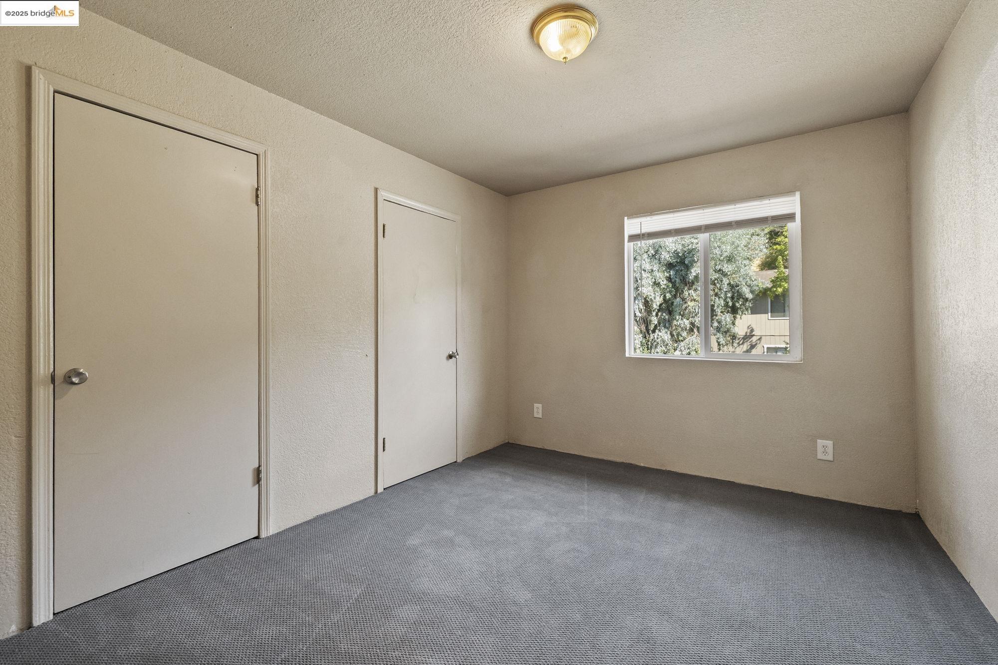 10702 10th Avenue Jamestown, CA 95327 - Photo 22 of 25 an empty room with windows