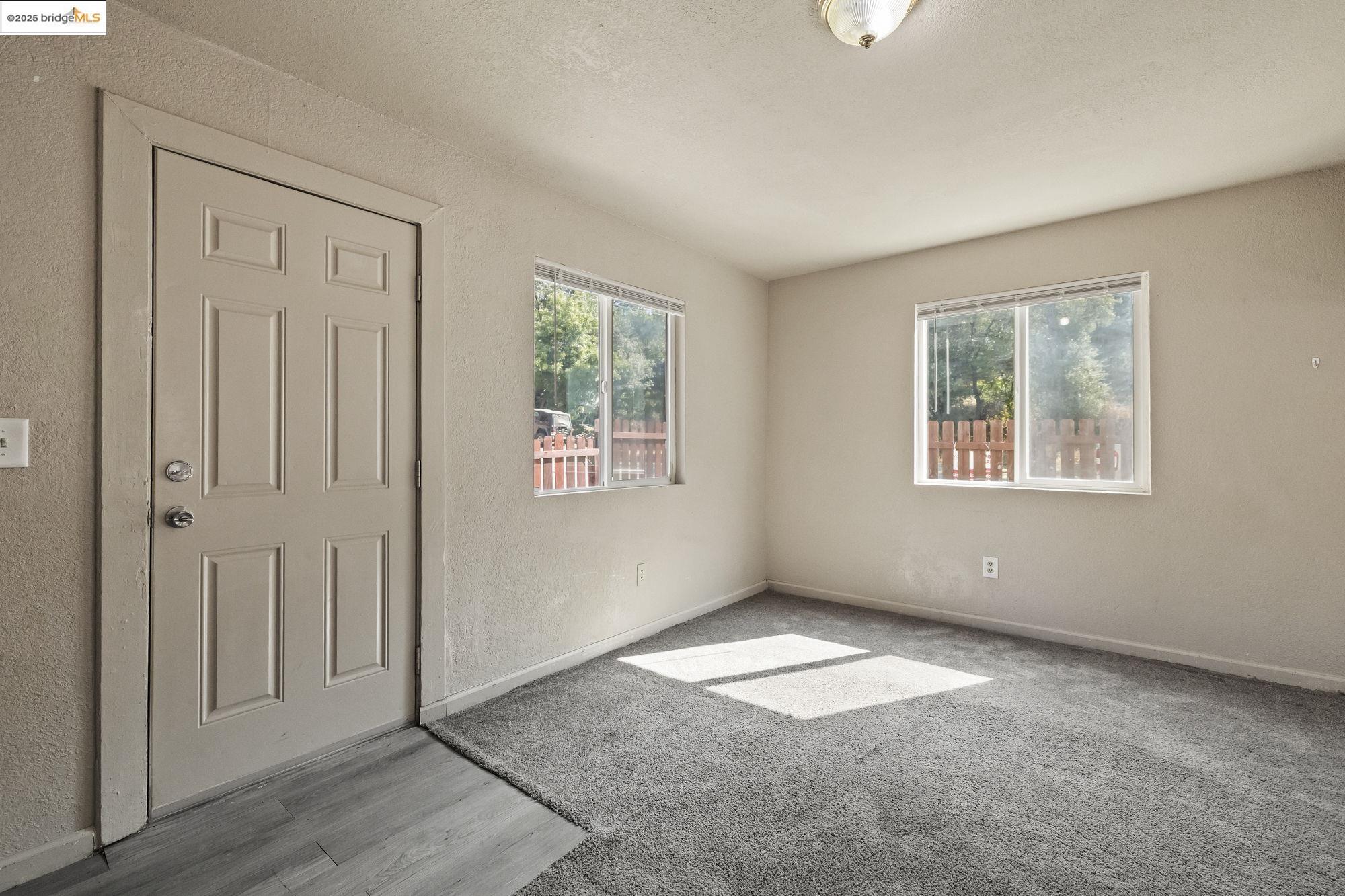 10702 10th Avenue Jamestown, CA 95327 - Photo 5 of 25 an empty room with windows