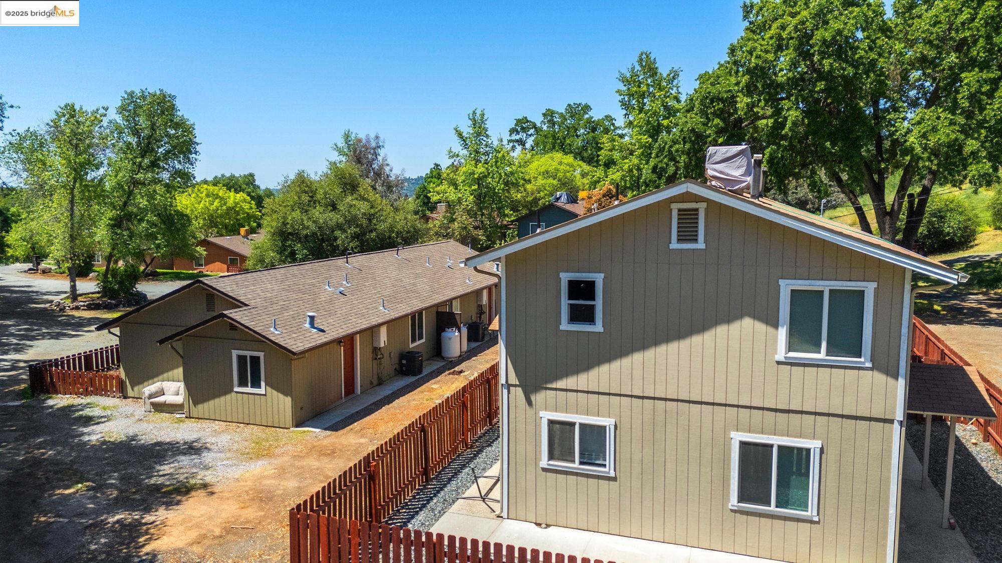 10702 10th Avenue Jamestown, CA 95327 - Photo 7 of 25 a house with trees in the background