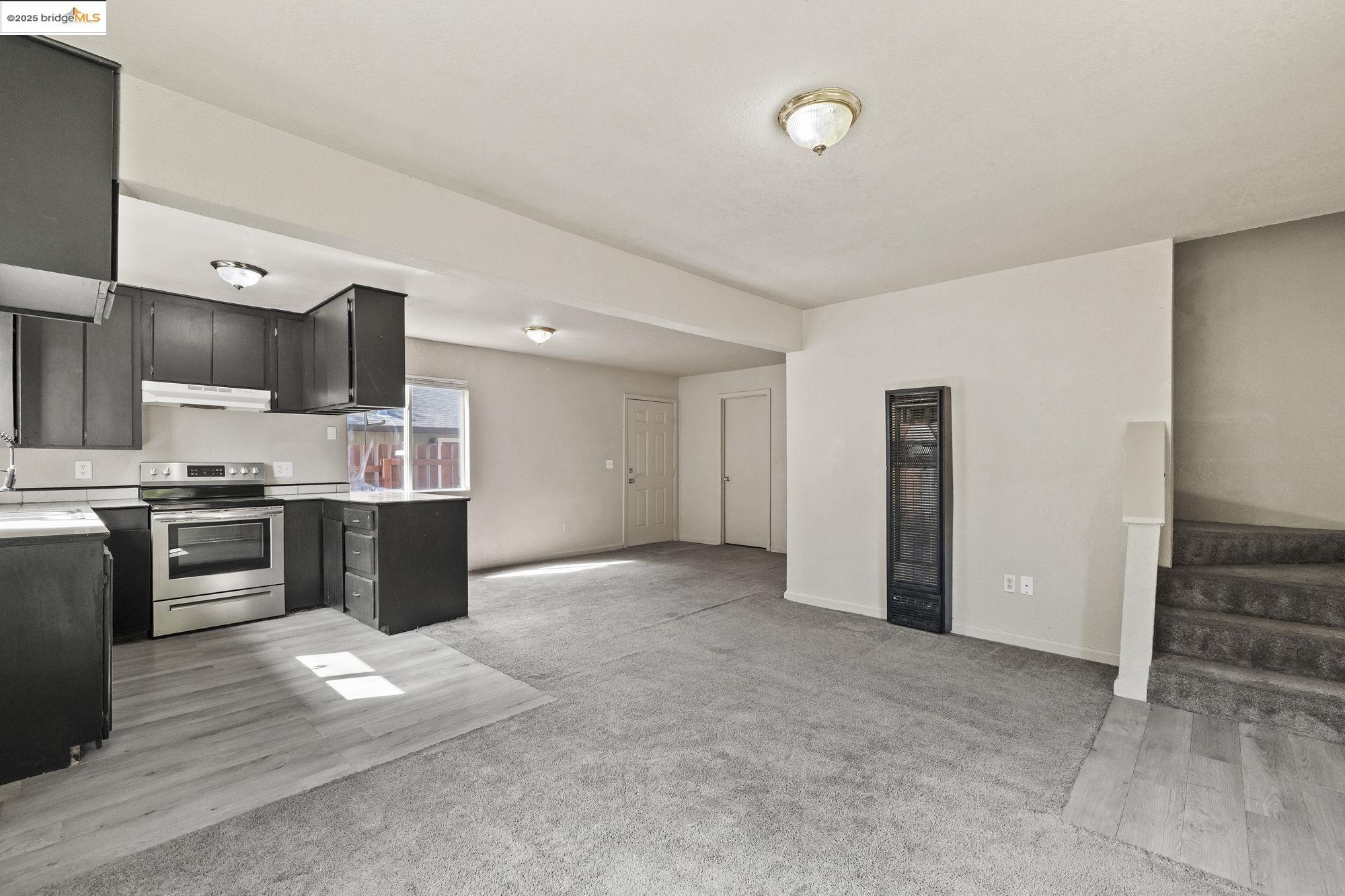 10702 10th Avenue Jamestown, CA 95327 - Photo 9 of 25 a view of kitchen with refrigerator and stove