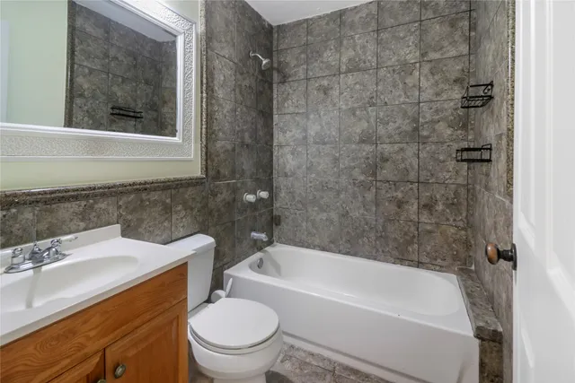 a bathroom with a sink toilet and bathtub
