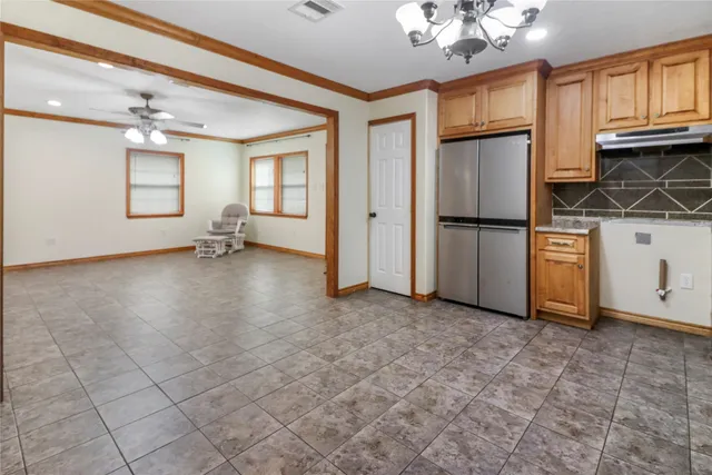 a view of kitchen with furniture and a window