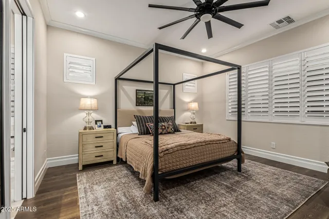 a bedroom with a bed and window