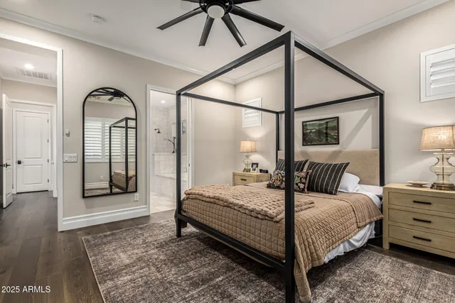 a bedroom with a bed and a mirror