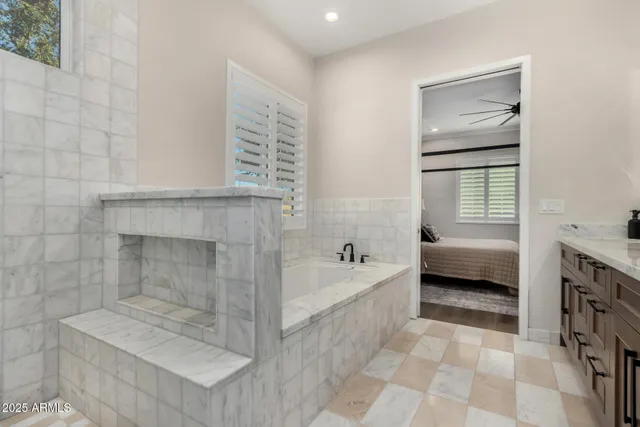 a bathroom with a bathtub and a shower
