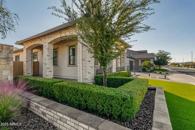 a front view of a house with swimming pool having outdoor seating