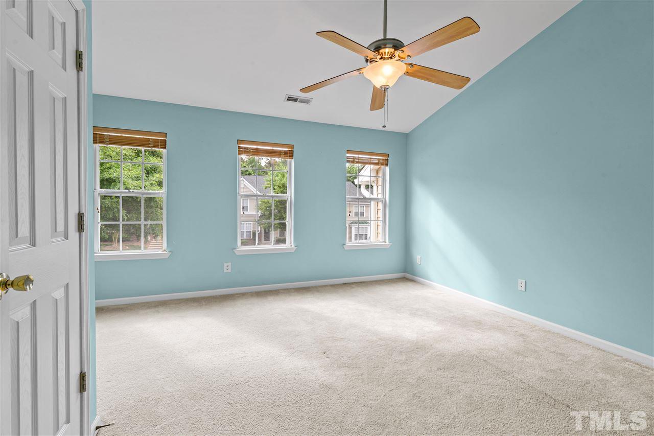 4822 Black Mountain Path Raleigh, NC 27612 - Photo 11 of 27 an empty room with windows and fan