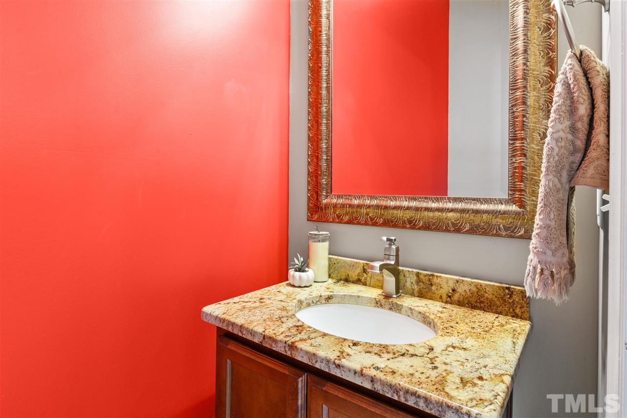 4822 Black Mountain Path Raleigh, NC 27612 - Photo 18 of 27 a bathroom with a granite countertop sink and a mirror