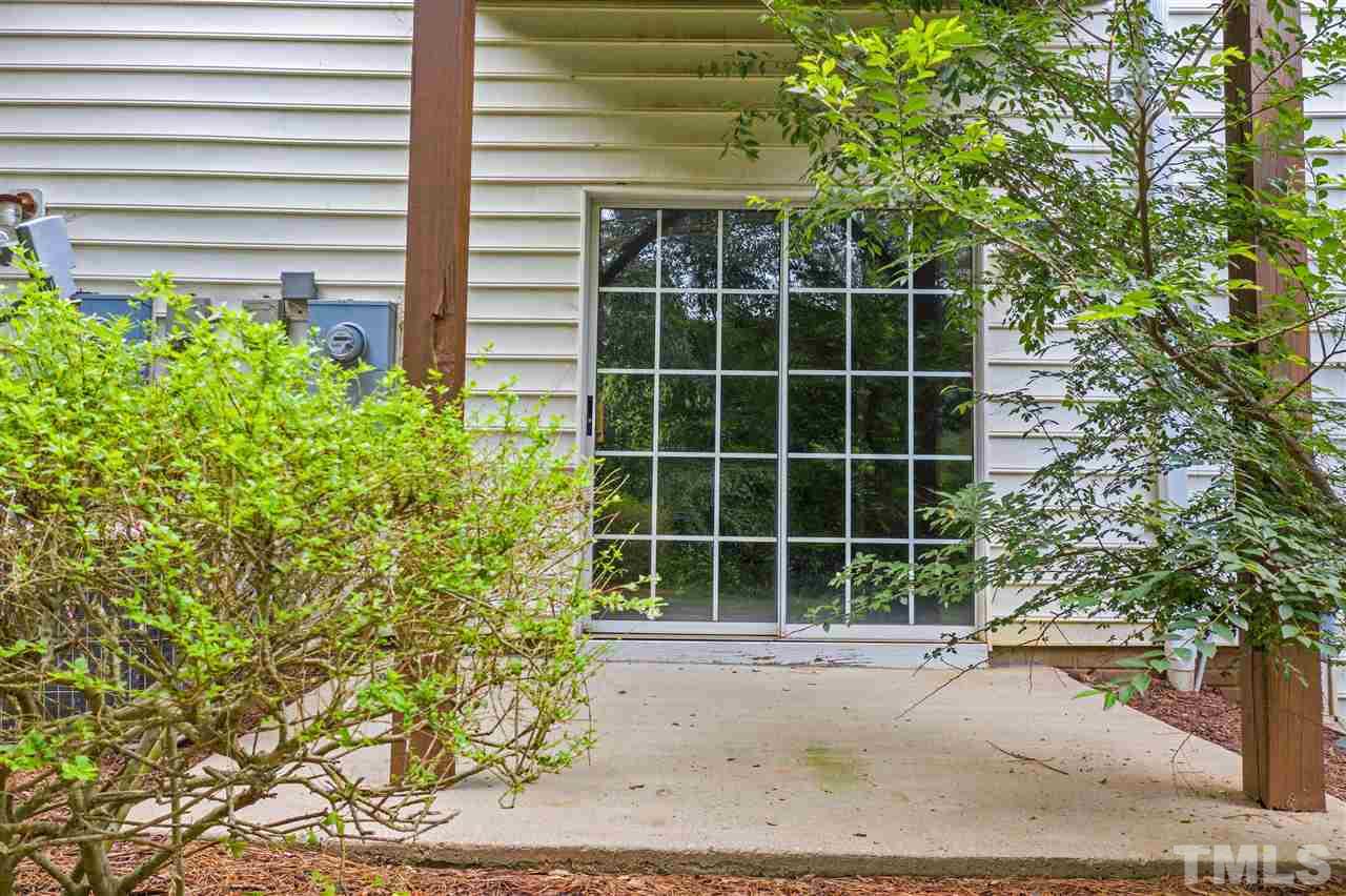 4822 Black Mountain Path Raleigh, NC 27612 - Photo 22 of 27 a view of a garden with a potted plant