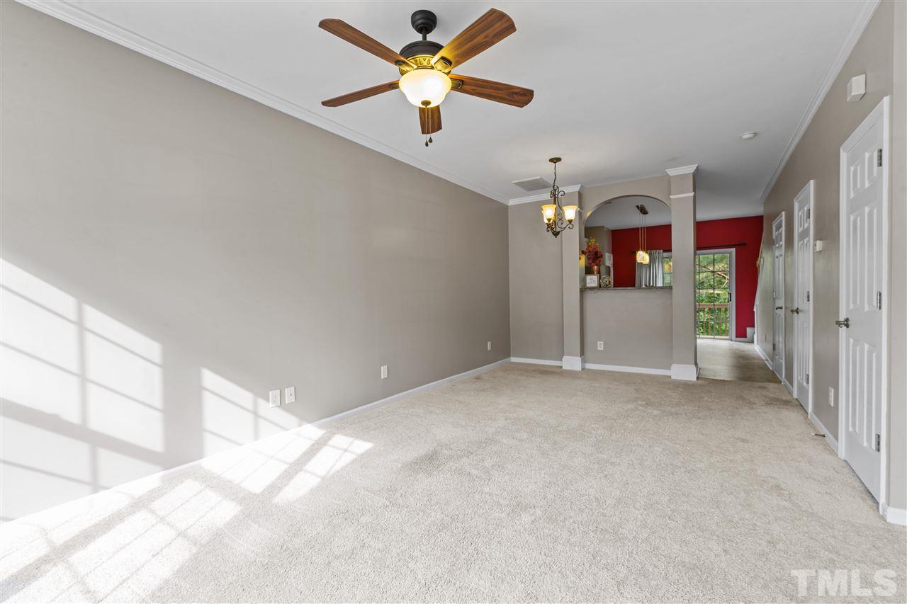 4822 Black Mountain Path Raleigh, NC 27612 - Photo 5 of 27 a view of a livingroom with a ceiling fan and window