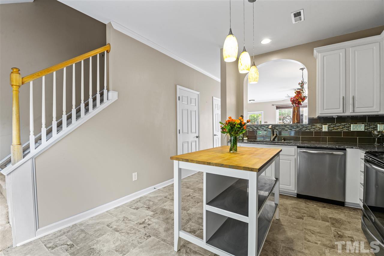 4822 Black Mountain Path Raleigh, NC 27612 - Photo 10 of 27 a kitchen with a sink cabinets and window