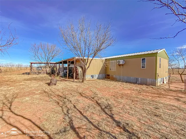 a view of a backyard with wooden floor