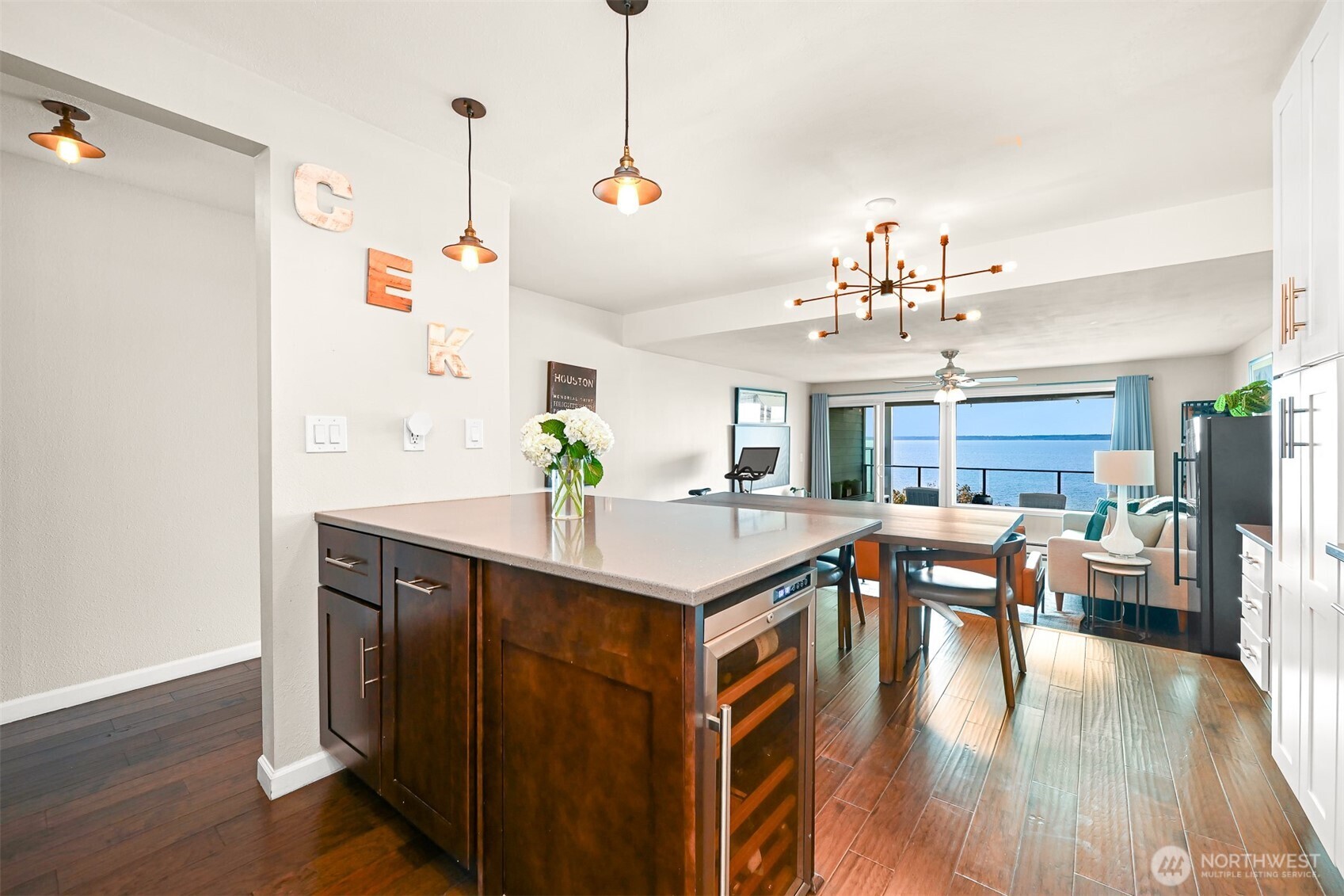 600 South State Street, Unit 212 Bellingham, WA 98225 - Photo 15 of 37 a view of a dining room with furniture wooden floor and chandelier