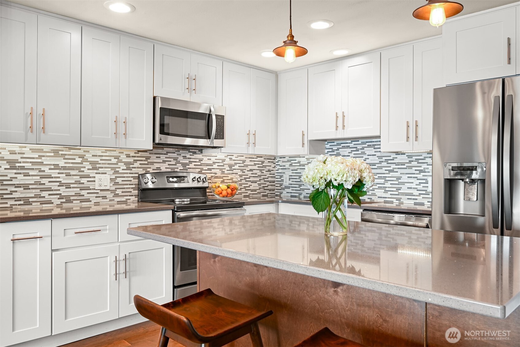 600 South State Street, Unit 212 Bellingham, WA 98225 - Photo 17 of 37 a kitchen with stainless steel appliances a sink a stove a microwave and cabinets