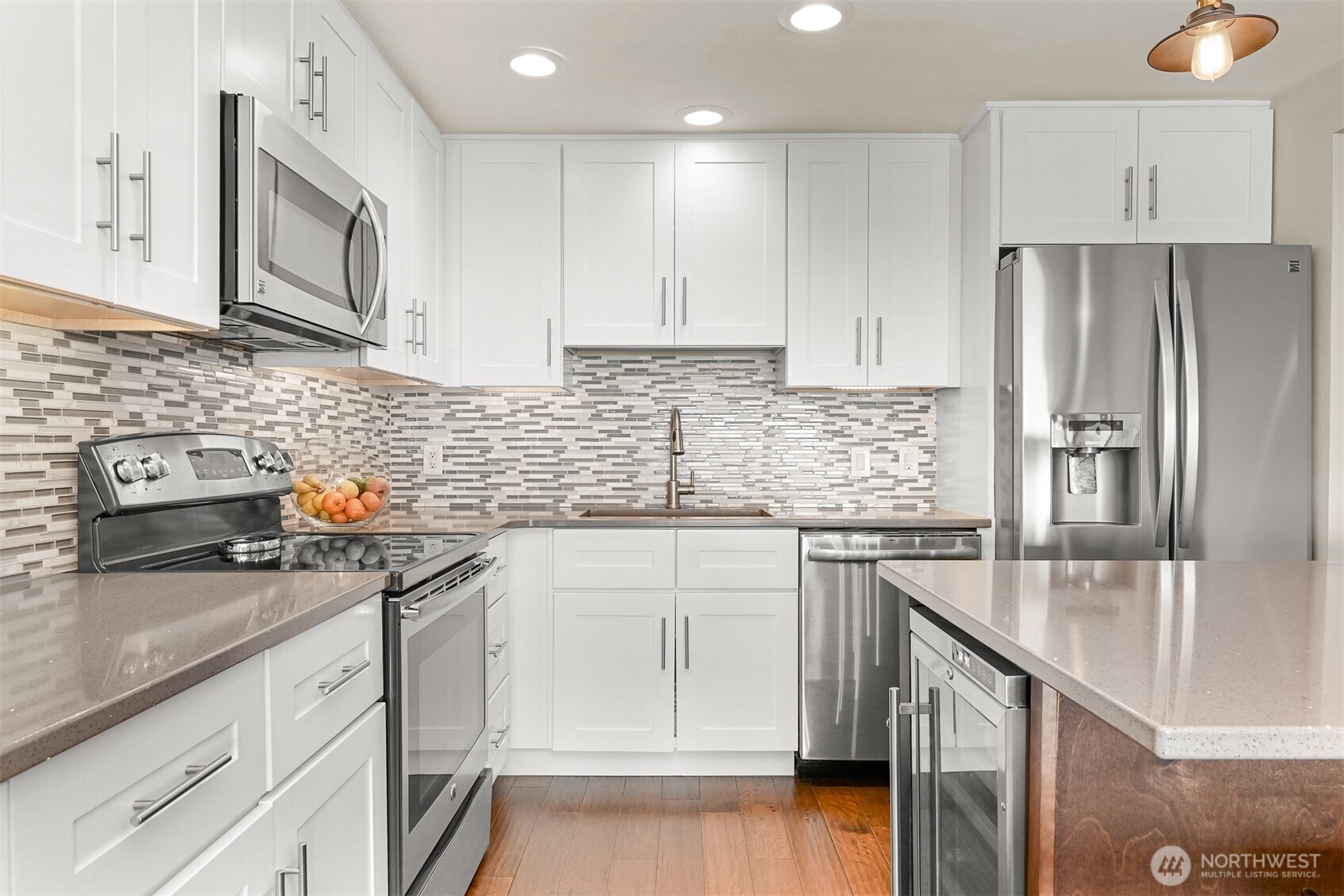 600 South State Street, Unit 212 Bellingham, WA 98225 - Photo 19 of 37 a kitchen with stainless steel appliances granite countertop a sink stove and refrigerator
