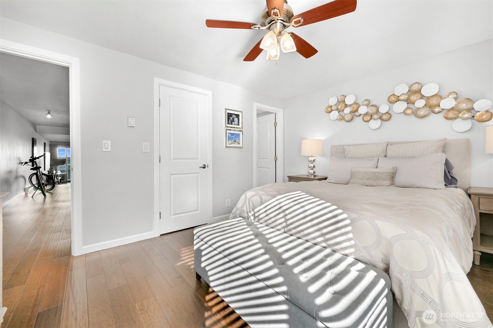 600 South State Street, Unit 212 Bellingham, WA 98225 - Photo 21 of 37 a bedroom with a large bed and a chandelier