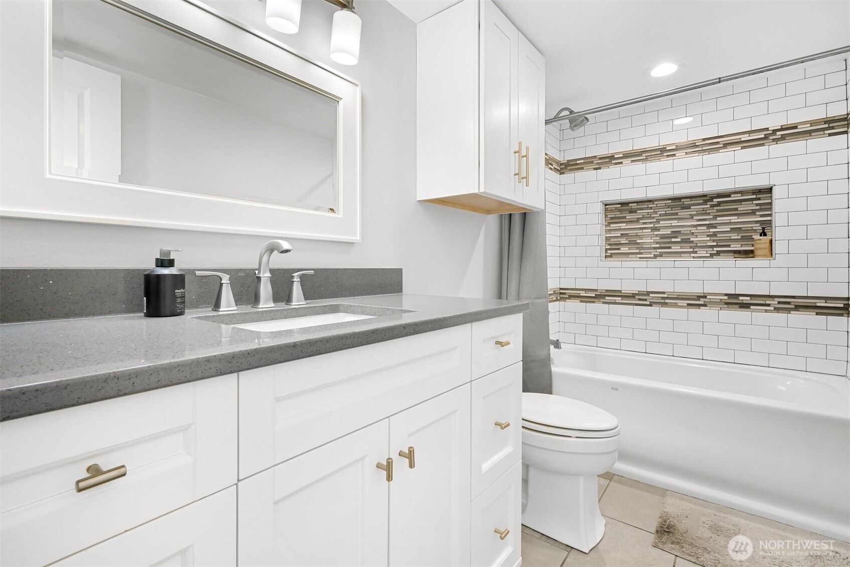 600 South State Street, Unit 212 Bellingham, WA 98225 - Photo 22 of 37 a bathroom with a sink a toilet and shower