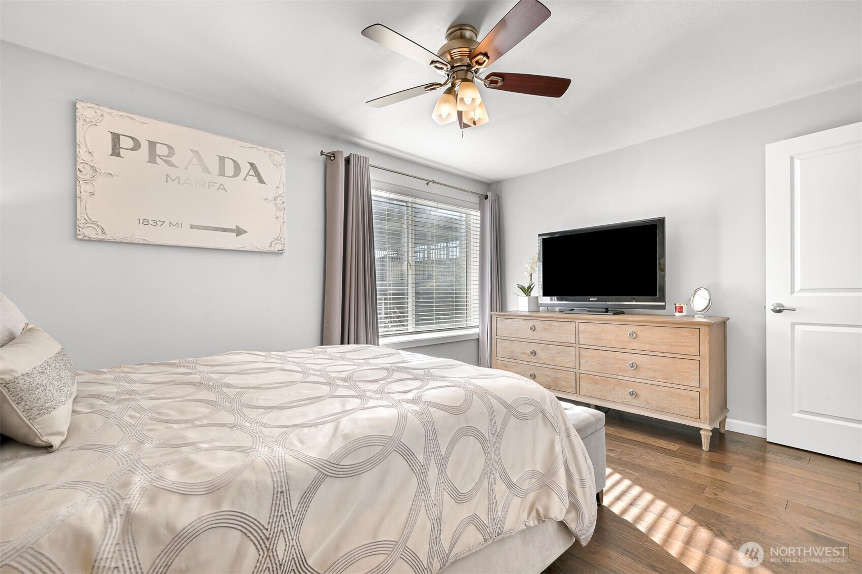 600 South State Street, Unit 212 Bellingham, WA 98225 - Photo 24 of 37 a bedroom with a flat screen tv and a bed