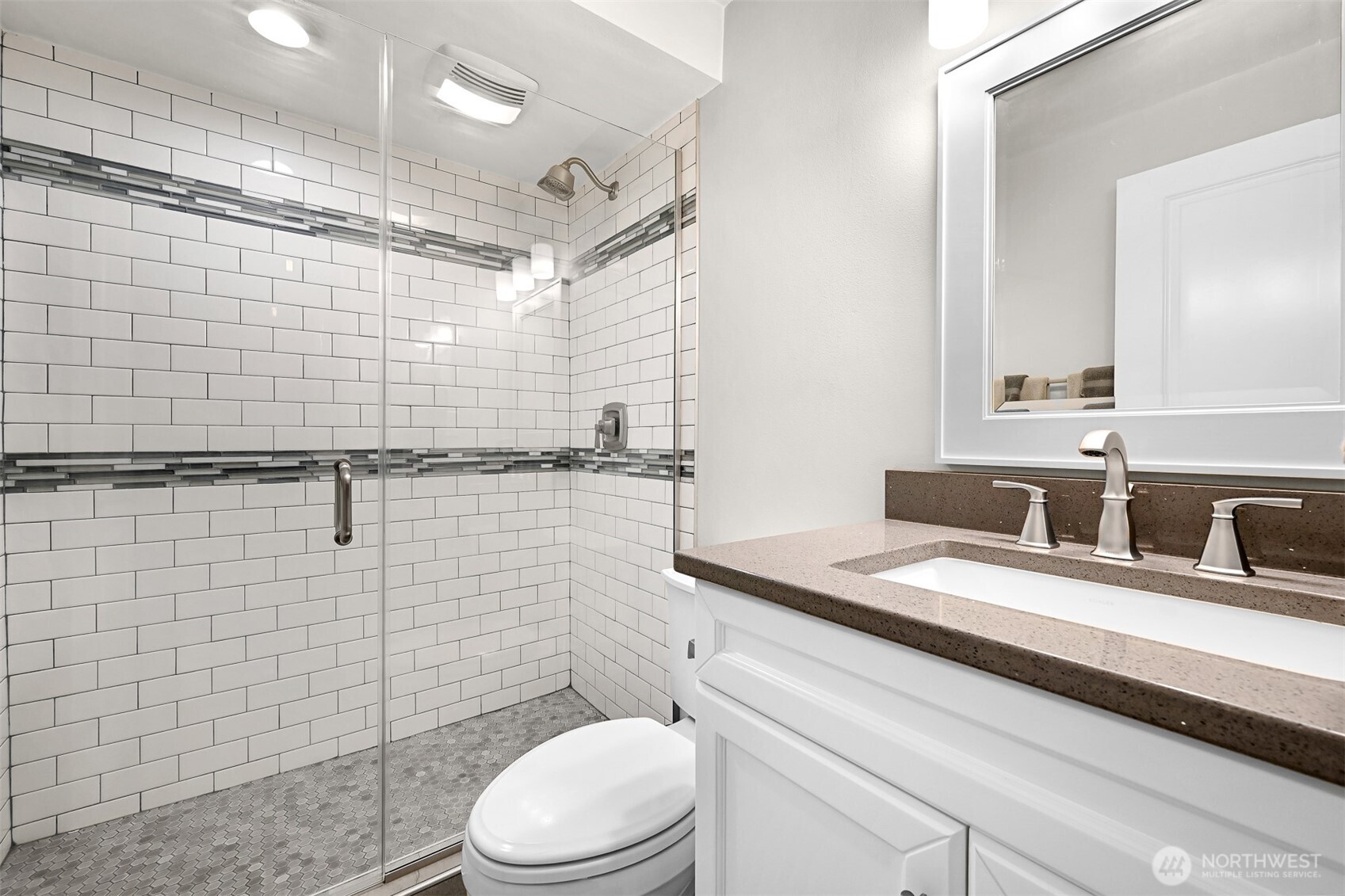 600 South State Street, Unit 212 Bellingham, WA 98225 - Photo 27 of 37 a bathroom with a sink a toilet and shower