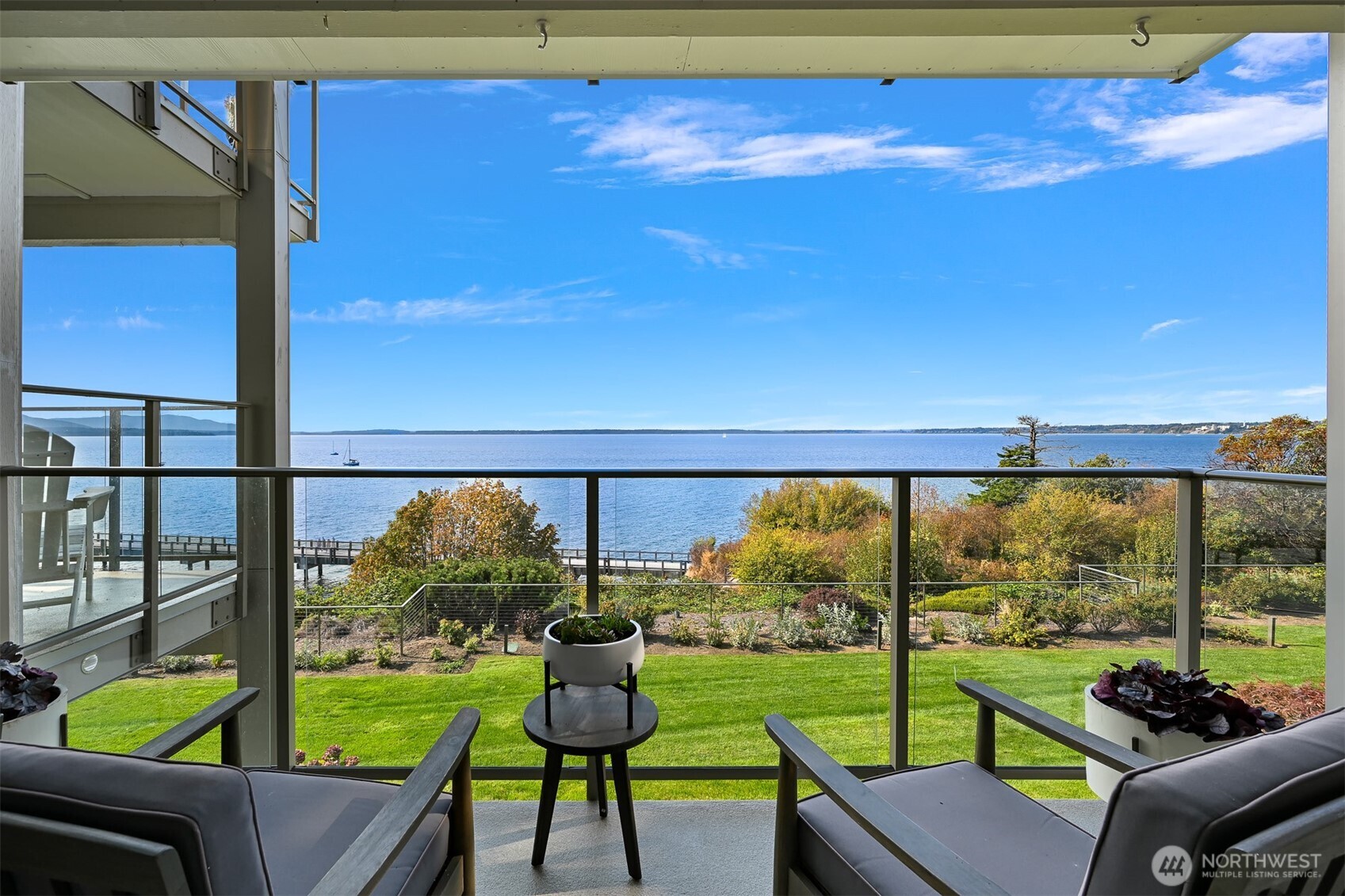 600 South State Street, Unit 212 Bellingham, WA 98225 - Photo 9 of 37 a view of a chairs and table in patio with a yard