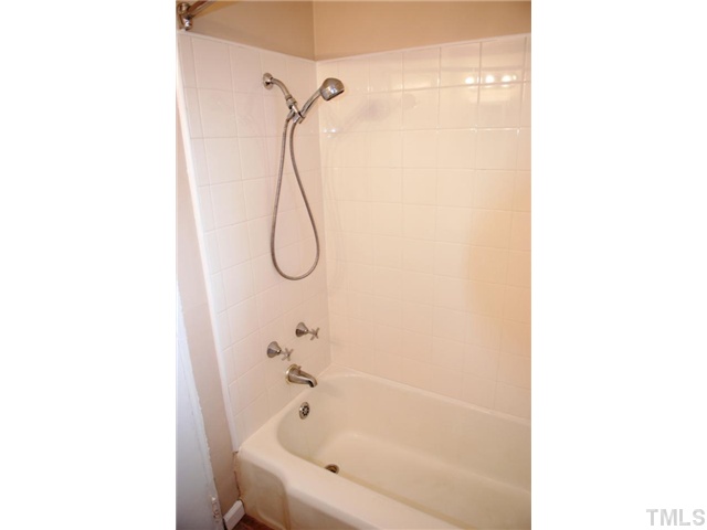 917 St Marys Street Raleigh, NC 27605 - Photo 11 of 13 a bathroom with a bath tub and shower