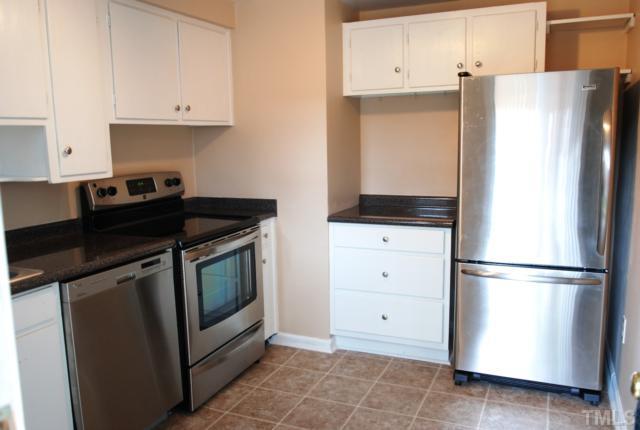 917 St Marys Street Raleigh, NC 27605 - Photo 4 of 13 a kitchen with appliances and cabinets