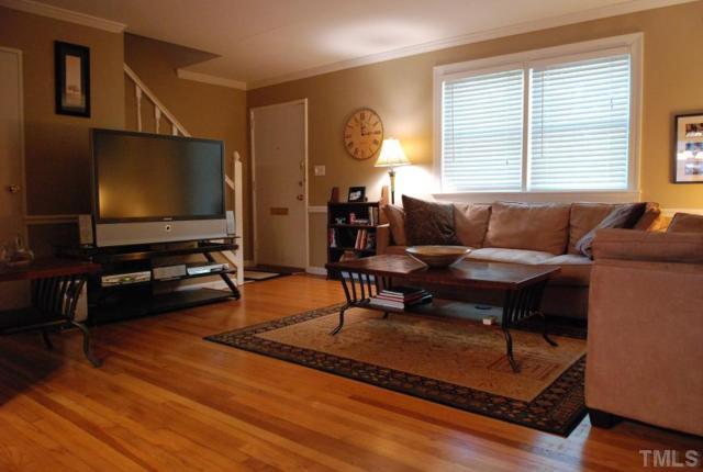 917 St Marys Street Raleigh, NC 27605 - Photo 6 of 13 a living room with furniture and a flat screen tv