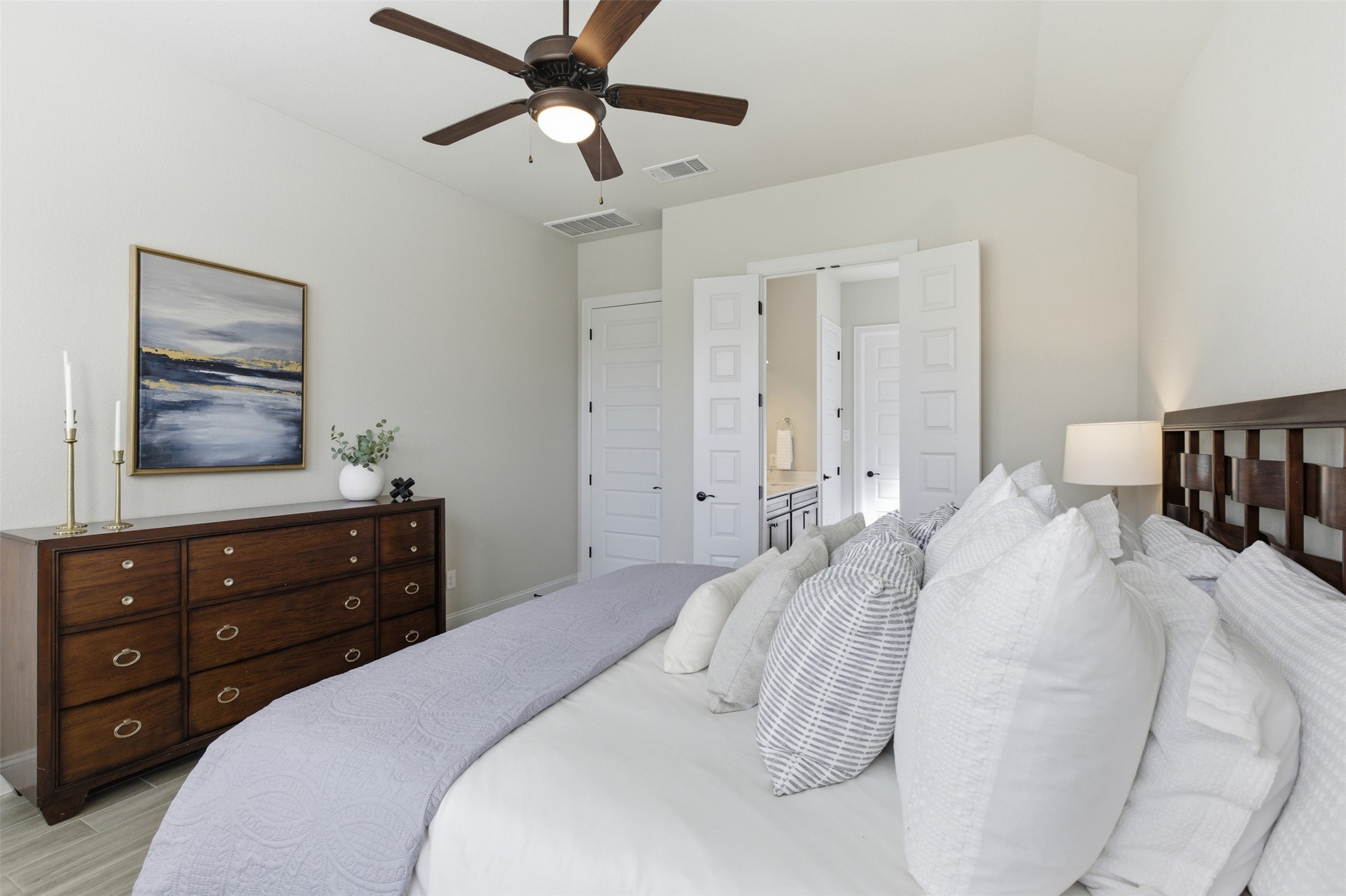 117 Old Trinity Way Georgetown, TX 78628 - Photo 20 of 38 Bedroom with ceiling fan, ensuite bath, and vaulted ceiling