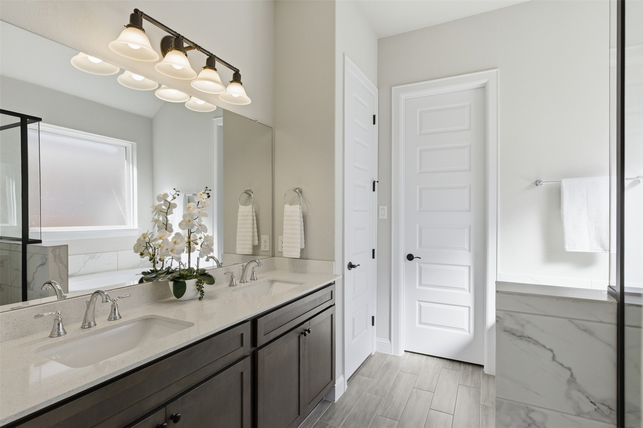 117 Old Trinity Way Georgetown, TX 78628 - Photo 22 of 38 Bathroom featuring double vanity, a marble finish shower, and a bath