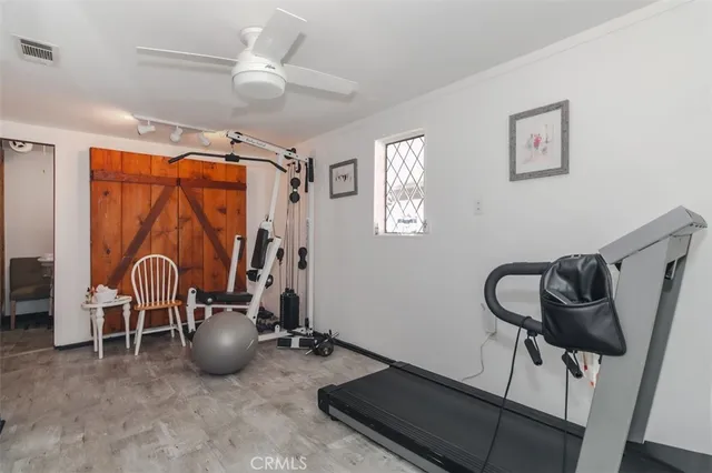 a view of a workspace with furniture and chandelier