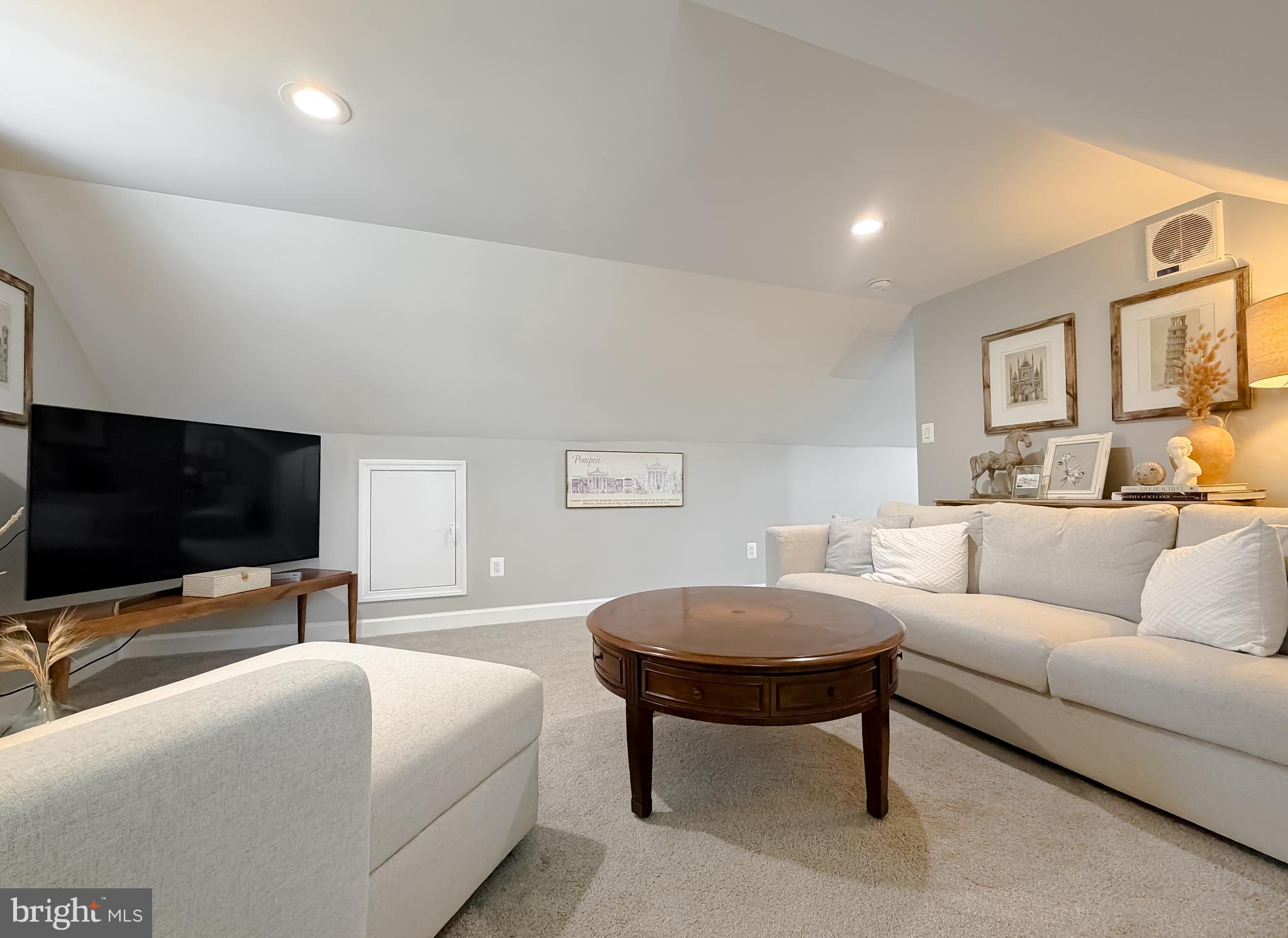 4985 Solomons Island Road Huntingtown, MD 20639 - Photo 27 of 50 a living room with furniture and a flat screen tv