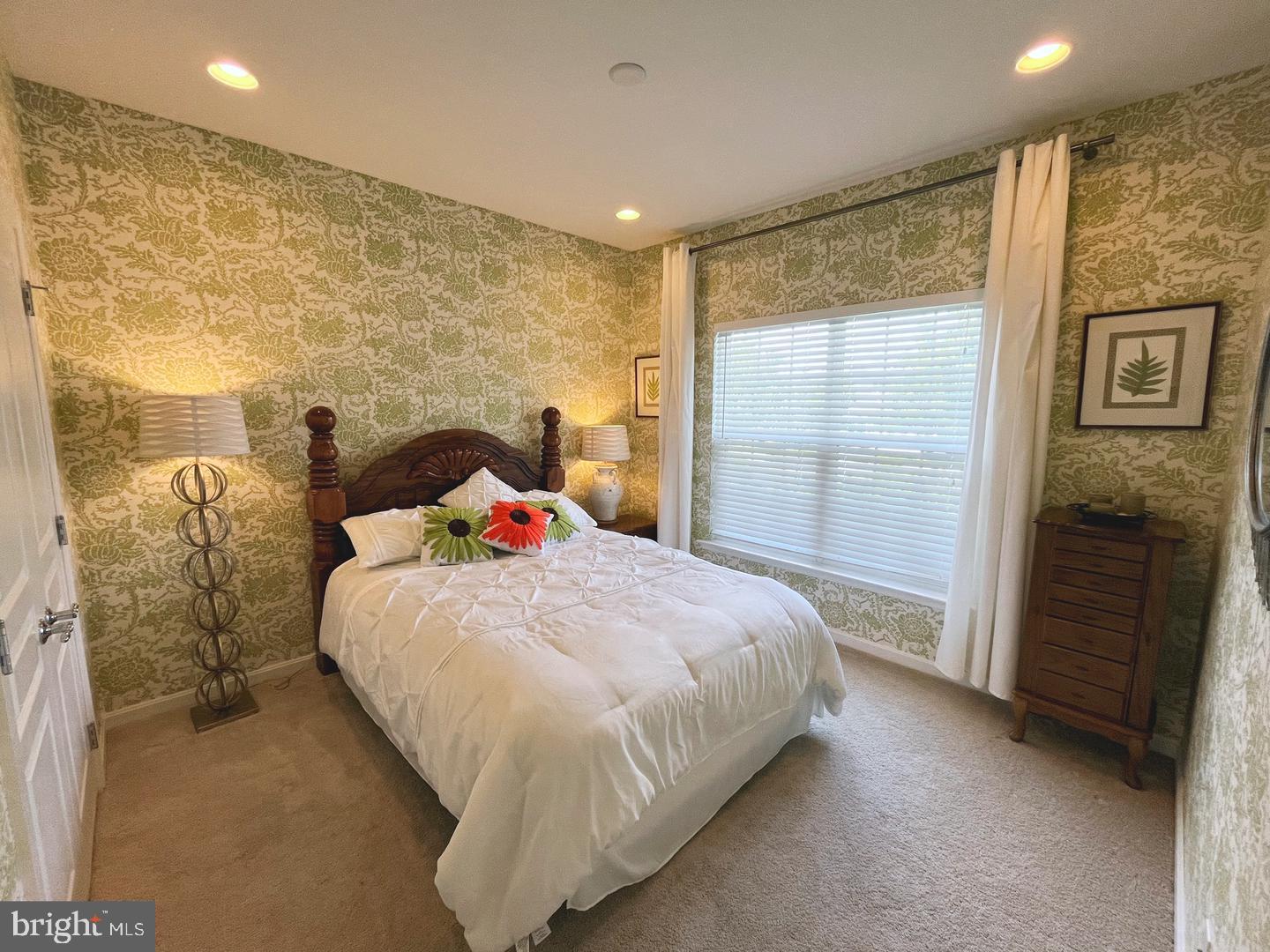 615 Prizer Court Downingtown, PA 19335 - Photo 15 of 35 a bed sitting in a bedroom next to a balcony