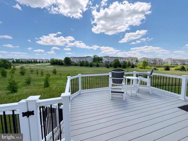 a view of a deck with two chairs and a table