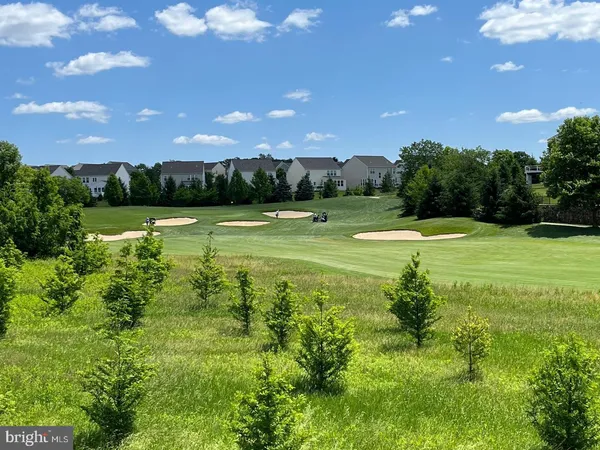 a view of an outdoor space and basketball court