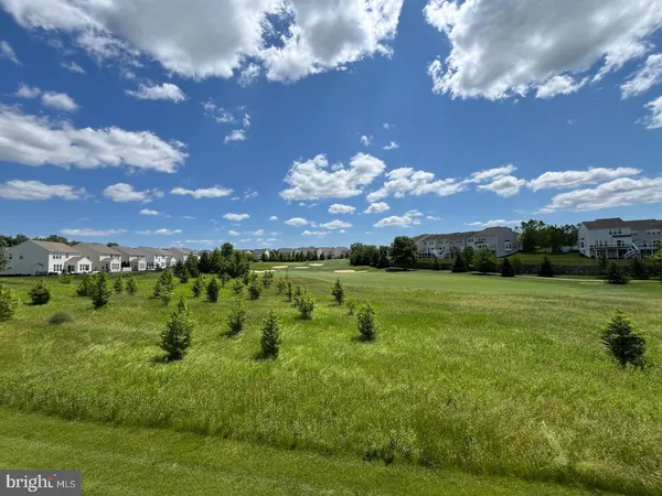 a view of a golf course with a lake