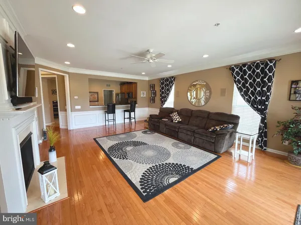 a living room with fireplace furniture and a flat screen tv