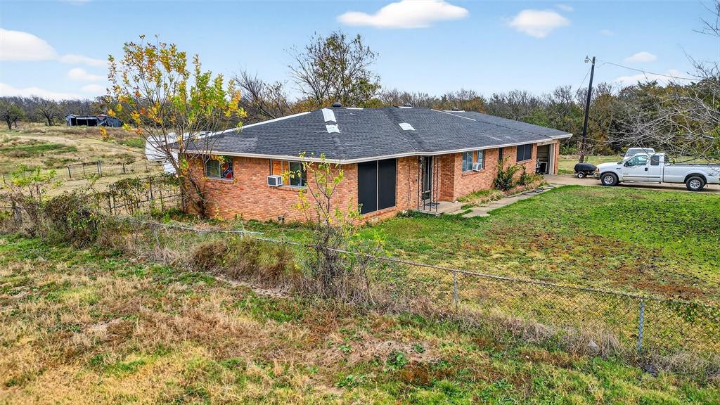 515 East Parnell Street Denison, TX 75021 - Photo 11 of 11 a view of a house with a yard
